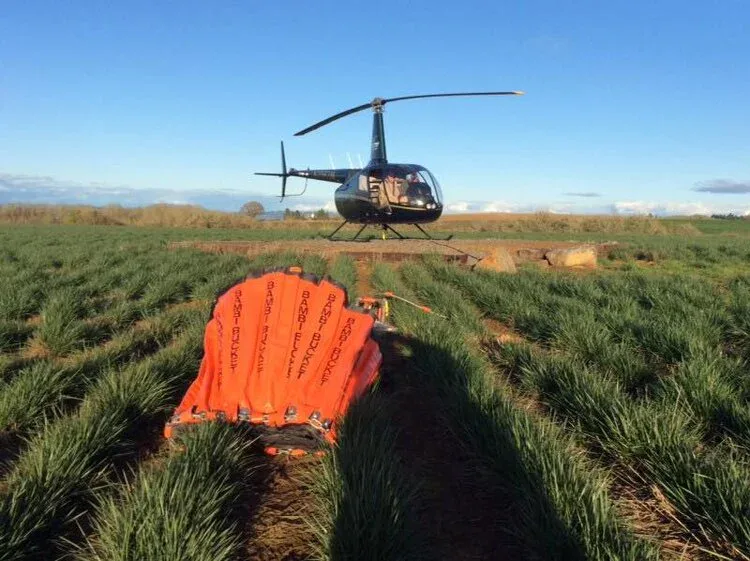 Robinson R-66 with Bambi bucket on long-line
