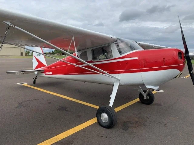 Cessna 140 side profile on the ramp