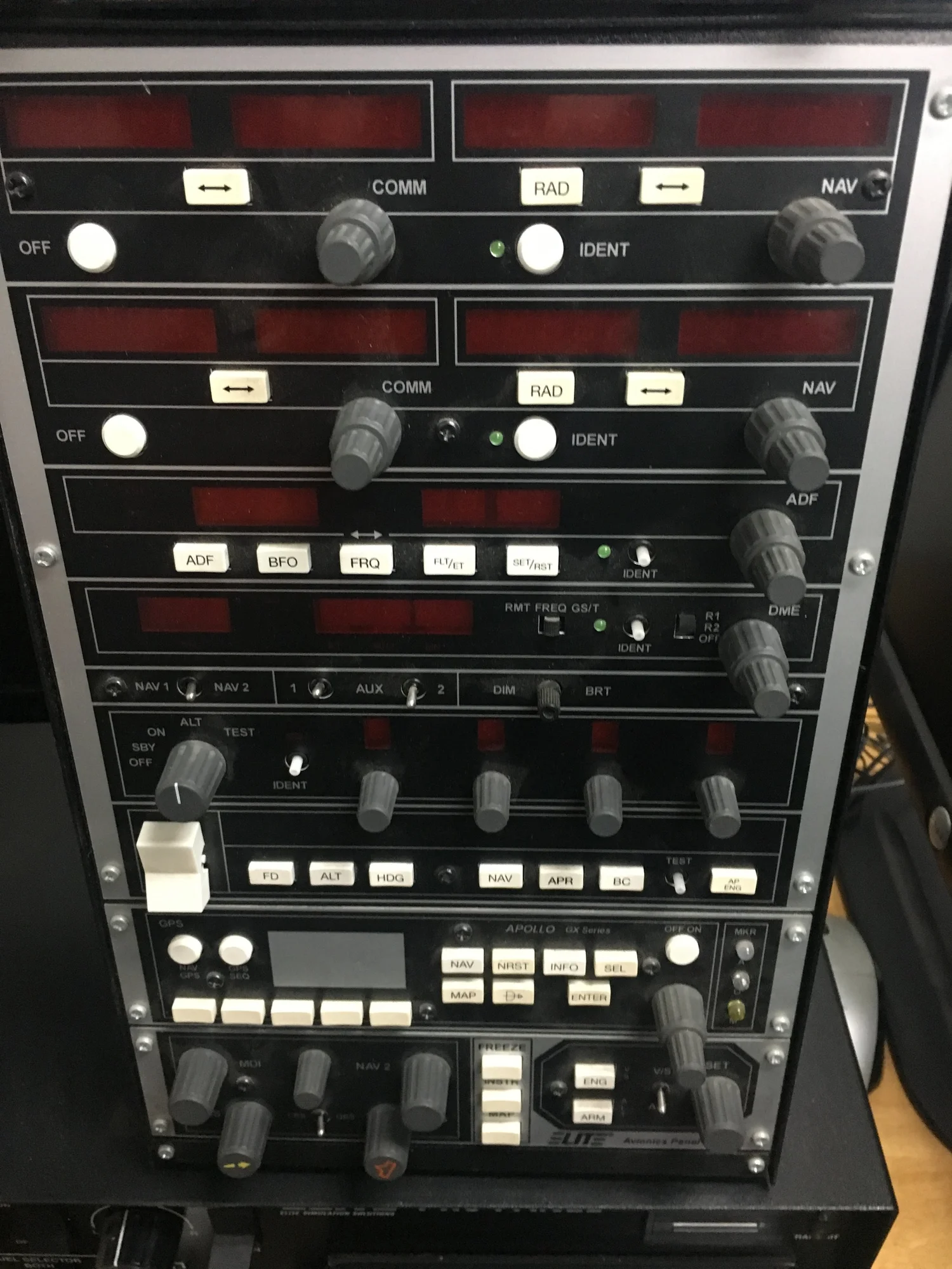 Avionics radio stack in the simulator — dual NAV/COM, ADF and DME
