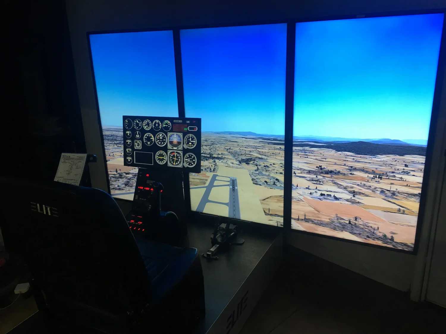 Elite TH-100 turbine helicopter simulator station with three-panel external visual display